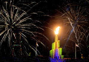 Fireworks illuminate Sheikh Khalifa stadium with a flame glowing above a spiral ramp inspired by Iraq's Tower of Babylon in Samarra during the opening ceremony of the pan-Arab Games in the Qatari capital Doha on December 9, 2011. 